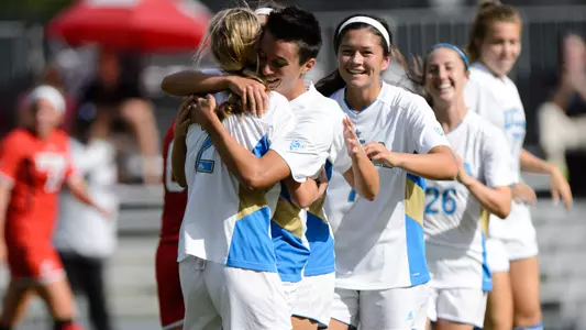 UCLA celebrates Kodi Lavrusky's game-winner vs. Utah (photo by Percy Anderson)