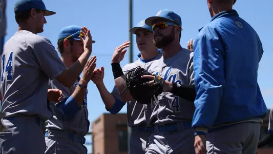 Eric Filia Greeted in the Dugout (Photo by Katie Meyers)