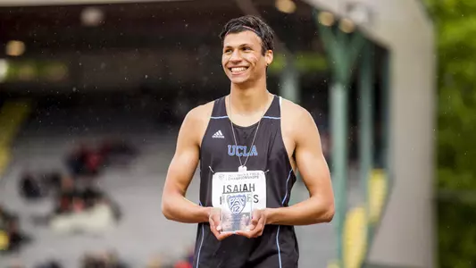 Isaiah Holmes Pac-12 trophy