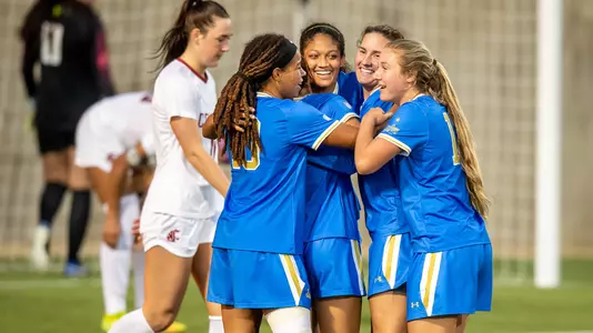The Bruins celebrate one of Reilyn Turner's two goals (photo by Scott Chandler)