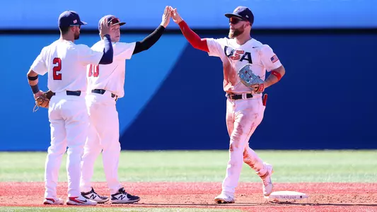 Eric Filia (r) celebrates with USA teammates after beating Dominican Republic