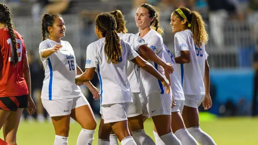 UCLA celebrates a goal by Olivia Athens (photo by Percy Anderson)