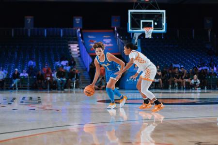 Kiki Rice dribbles against a Tennessee defender (Nov. 20)