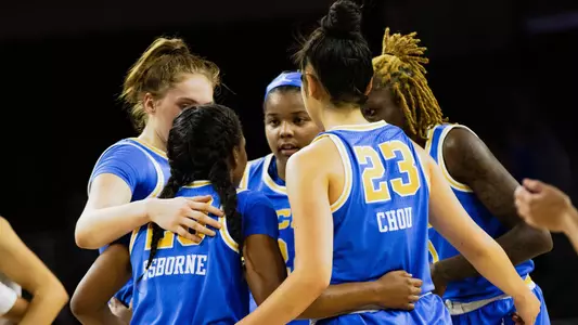 UCLA women's basketball team huddle