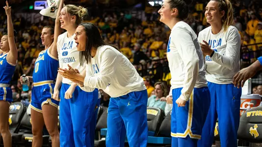 UCLA celebrates during a triple overtime win at Wyoming