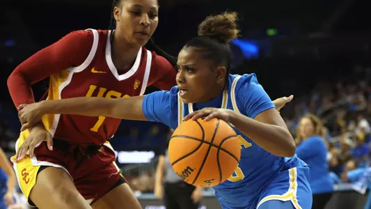 Londynn Jones #3 of the UCLA Bruins drives around Taylor Bigby #1 of the USC Trojans during the second half of a game at UCLA Pauley Pavilion on January 08, 2023 in Los Angeles, California. (Photo by Katharine Lotze/Getty Images)