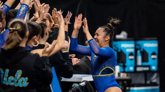 Emma Malabuyo high-fives her teammates