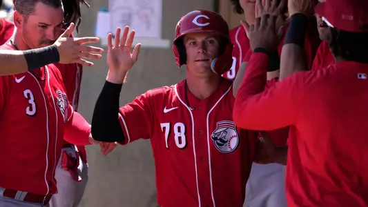 Mar 26, 2023; Salt River Pima-Maricopa, Arizona, USA; Cincinnati Reds second baseman Matt McLain (78) celebrates with teammates after scoring a run against the Colorado Rockies in the third inning at Salt River Fields at Talking Stick. Mandatory Credit: Rick Scuteri-USA TODAY Sports