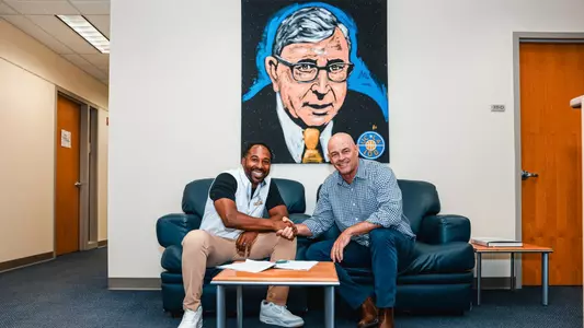 UCLA's Martin Jarmond and JMI Sports' Erik Judson