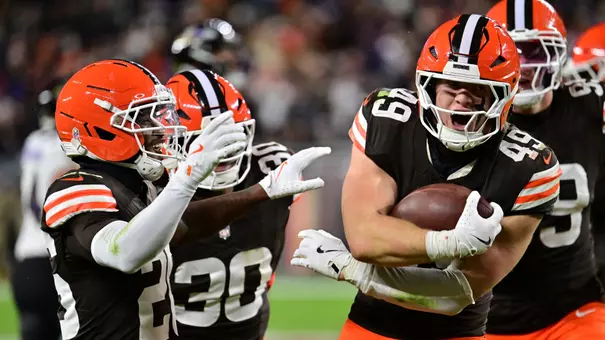 Nov 16, 2025; Cleveland, Ohio, USA; Cleveland Browns linebacker Carson Schwesinger (49) celebrates an interception with cornerback Myles Harden (26) during the third quarter against the Baltimore Ravens at Huntington Bank Field. Mandatory Credit: Ken Blaze-Imagn Images