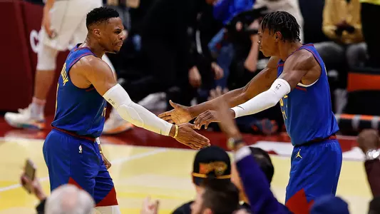 Nov 22, 2024; Denver, Colorado, USA; Denver Nuggets forward Peyton Watson (8) reacts with guard Russell Westbrook (4) after a play in the fourth quarter against the Dallas Mavericks at Ball Arena. Mandatory Credit: Isaiah J. Downing-Imagn Images