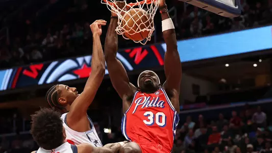 Adem Bona, Philadelphia 76ers center (30) dunks ball, as Washington Wizards forward Alex Sarr (20) defends in the first half at Capital One Arena. Mandatory Credit: Geoff Burke-Imagn Images