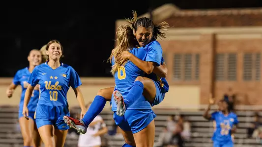 Oruha Hayashi celebrates with Grace Shank after scoring her first official UCLA goal