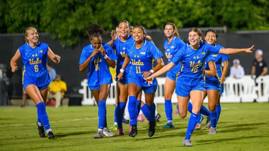 Emma Egizii and the Bruins celebrate the go-ahead goal