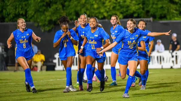 Emma Egizii and the Bruins celebrate the go-ahead goal