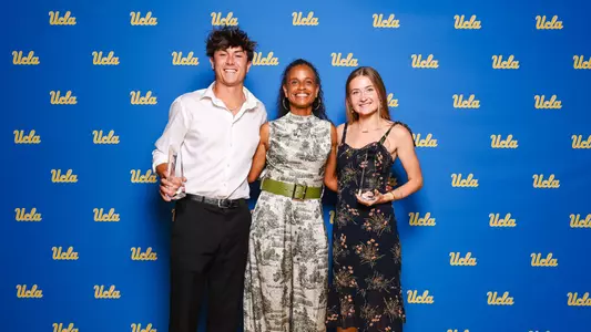 2025-26 Scholar-Athletes of the Year Shawn Toney and Annika Salz with Director of Track & Field/Cross Country Joanna Hayes
