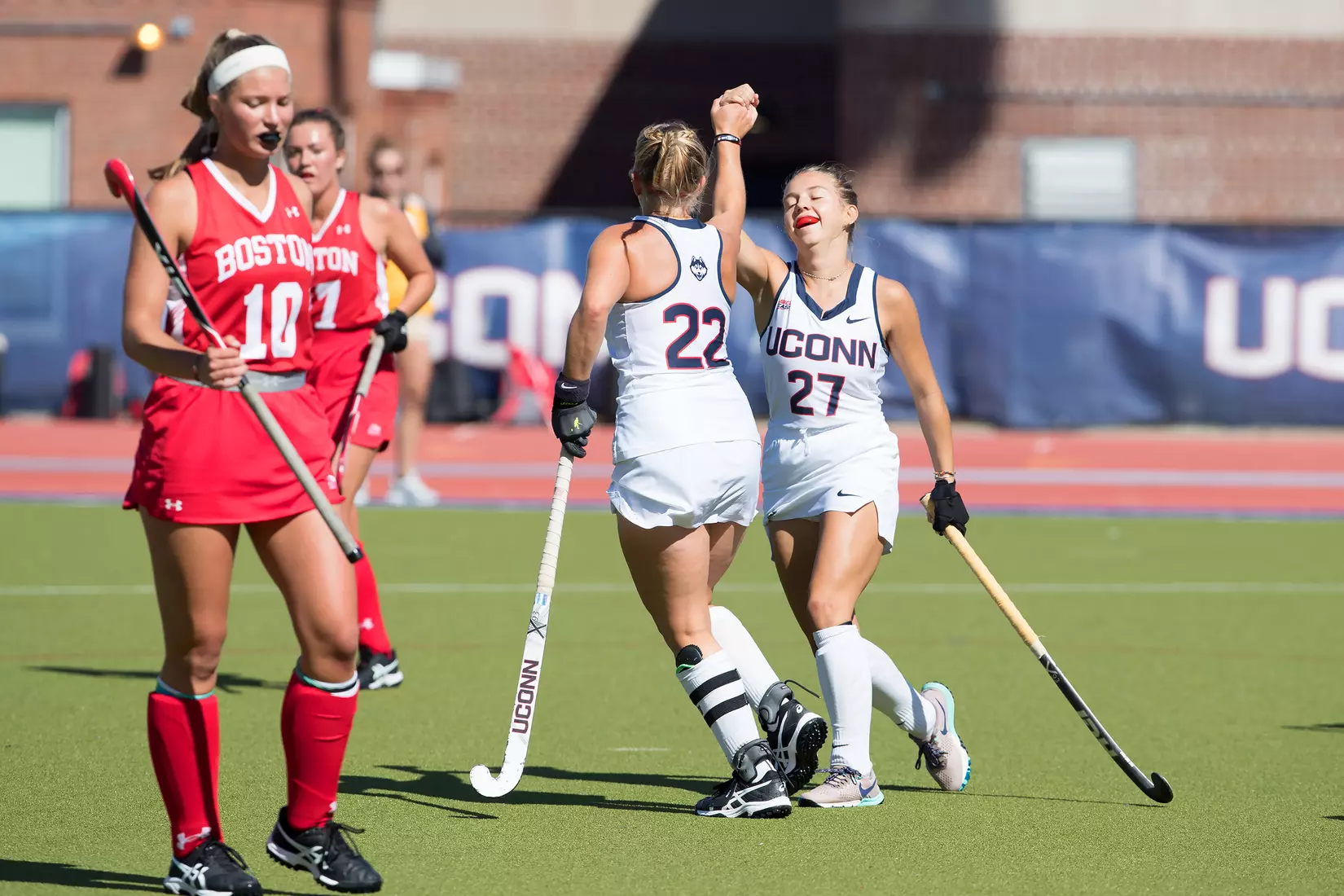 Svea Boker and Olivia Clarke celebrate after a goal vs. BU.