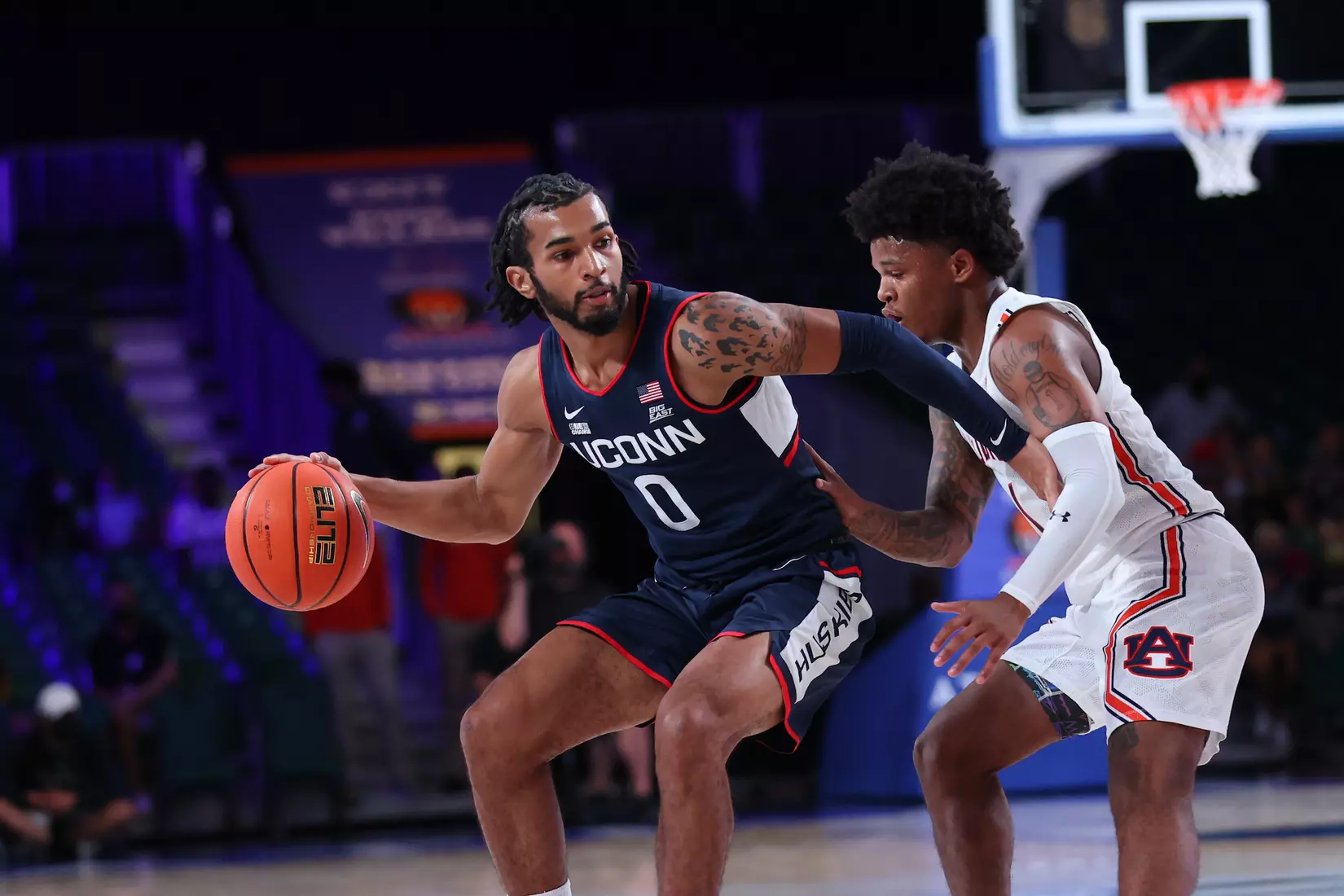 Connecticut Huskies guard Jalen Gaffney (0) and Auburn Tigers guard Wendell Green Jr. (1) at the Battle 4 Atlantis Wednesday, November 24, 2021 at Atlantis, Paradise Island in the Bahamas. (Photo by Tim Aylen)