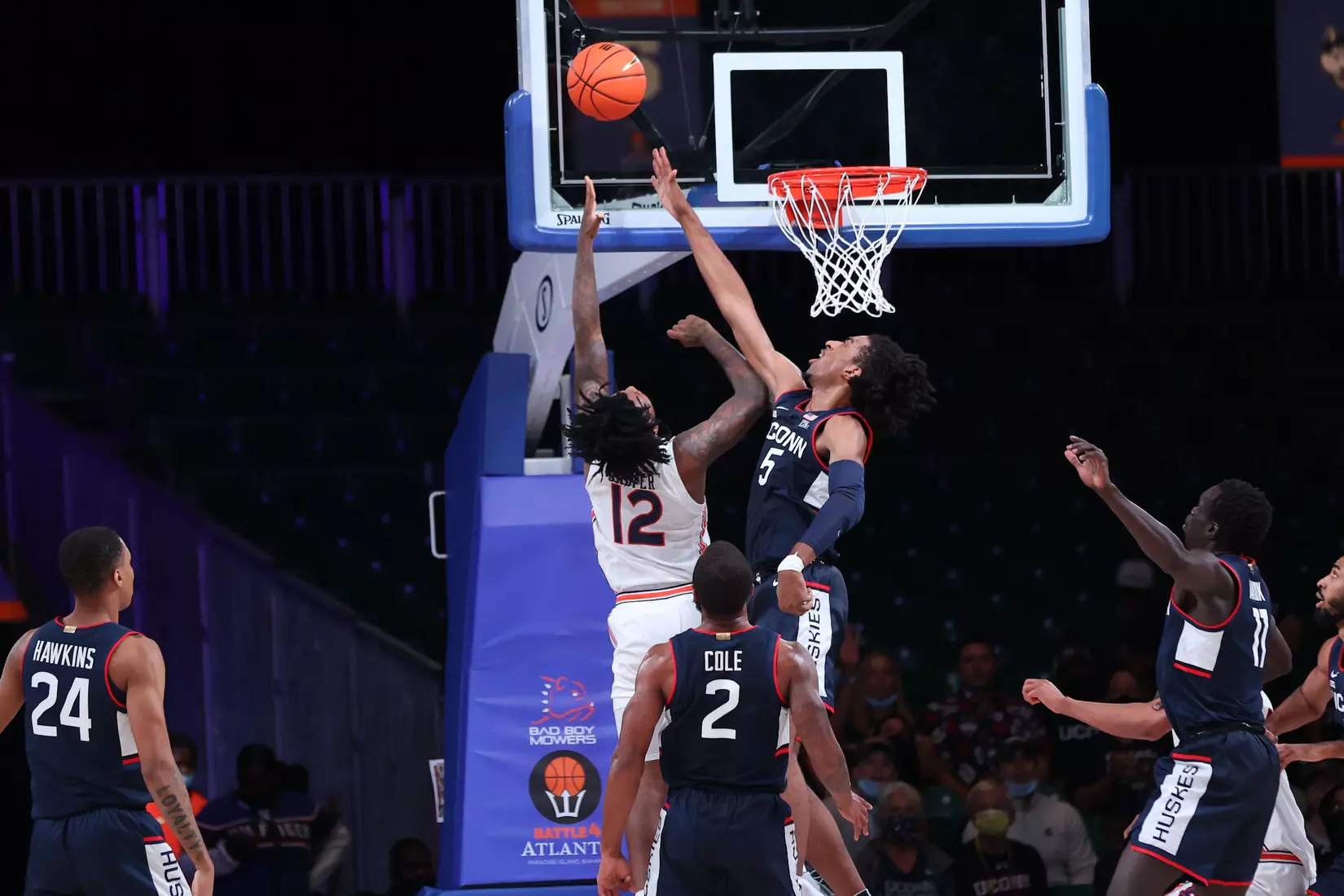 Auburn Tigers guard Zep Jasper (12) and Connecticut Huskies forward Isaiah Whaley (5) at the Battle 4 Atlantis Wednesday, November 24, 2021 at Atlantis, Paradise Island in the Bahamas. (Photo by Tim Aylen)