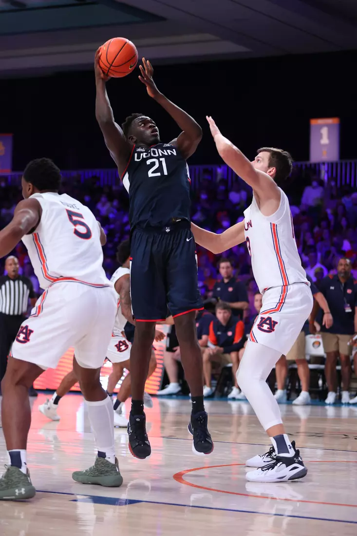 Connecticut Huskies forward Adama Sanogo (21)and Auburn Tigers forward Walker Kessler (13) at the Battle 4 Atlantis Wednesday, November 24, 2021 at Atlantis, Paradise Island in the Bahamas. (Photo by Tim Aylen)
