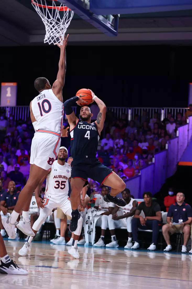 Connecticut Huskies guard Tyrese Martin (4) and Auburn Tigers forward Jabari Smith (10) at the Battle 4 Atlantis Wednesday, November 24, 2021 at Atlantis, Paradise Island in the Bahamas. (Photo by Tim Aylen)