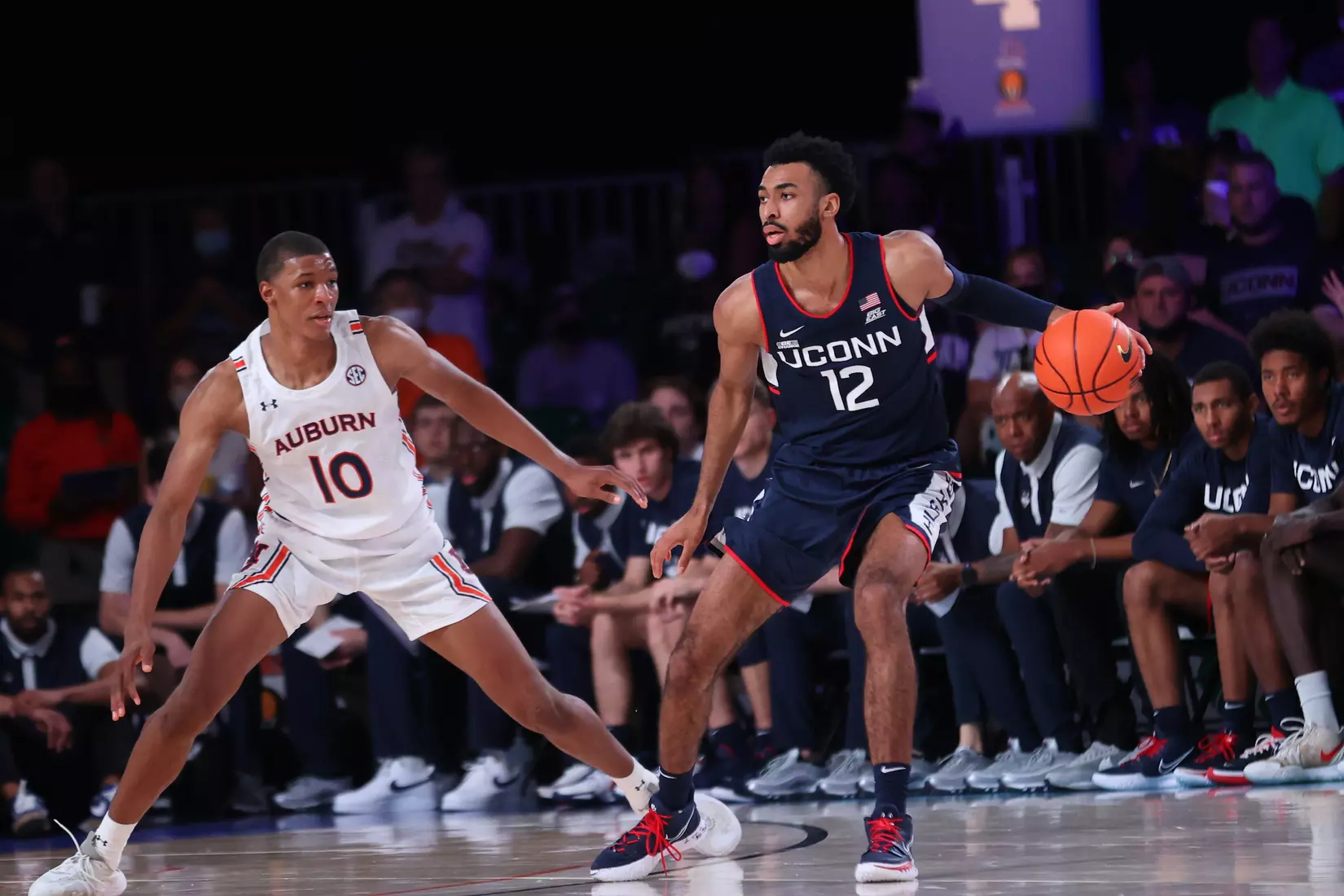 Connecticut Huskies forward Tyler Polley (12) and Auburn Tigers forward Jabari Smith (10) at the Battle 4 Atlantis Wednesday, November 24, 2021 at Atlantis, Paradise Island in the Bahamas. (Photo by Tim Aylen)