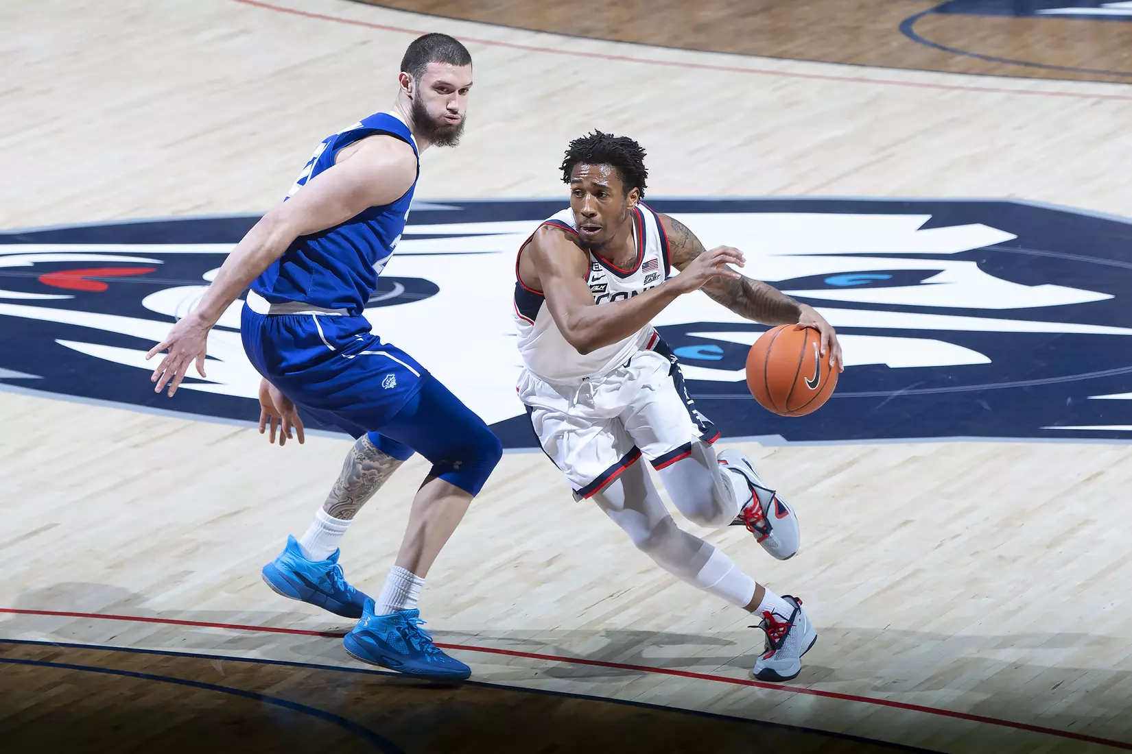 Brendan Adams drives to the basket against Seton Hall on February 6, 2021.