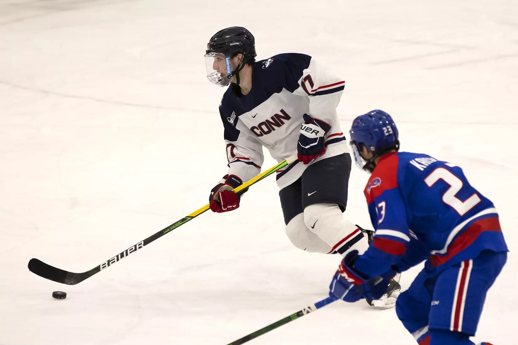 Marc Gatcomb looks to dish to a teammate against UMass Lowell on December 21, 2020.