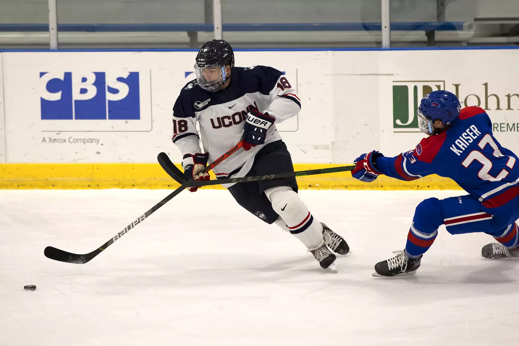 John Spetz skates by a Lowell defender on December 21, 2020.