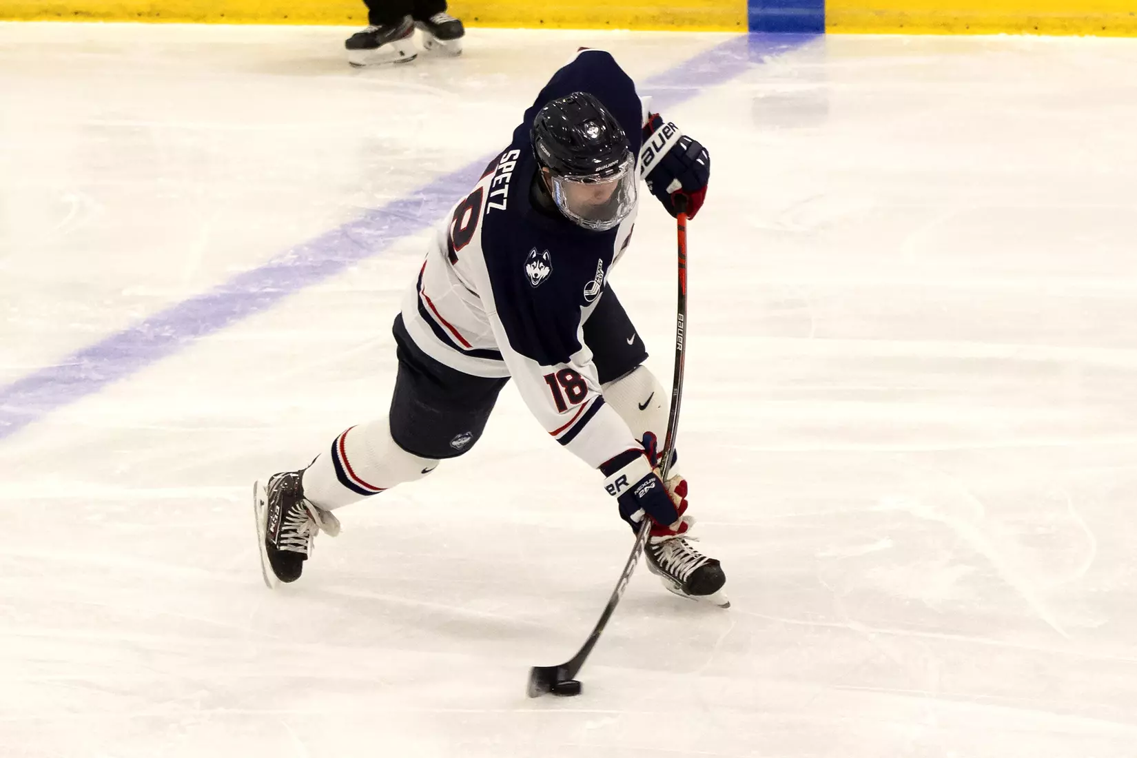 John Spetz takes a slap shot against UMass Lowell on December 21, 2020.