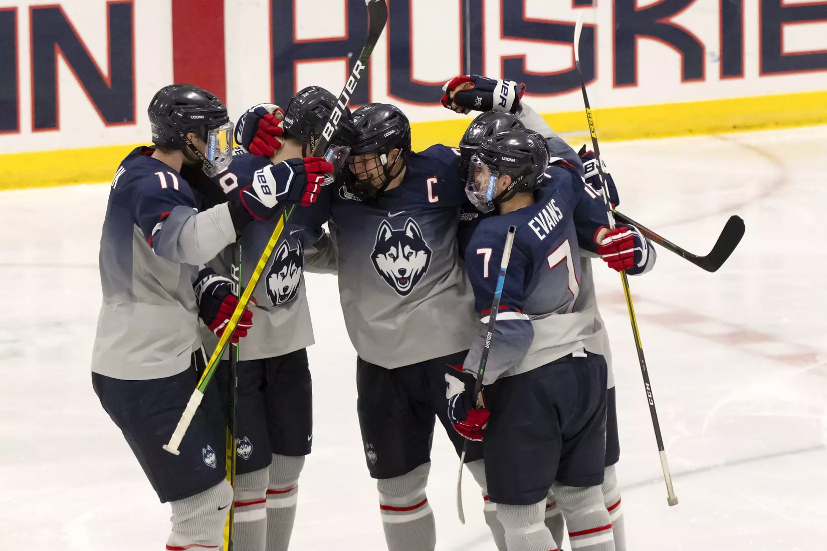 The Huskies celebrate Adam Karashik's goal against Providence on December 28, 2020.