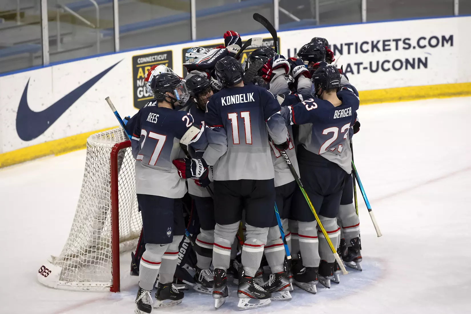 Huskies celebrate their 2-0 win against Providence on December 28, 2020.