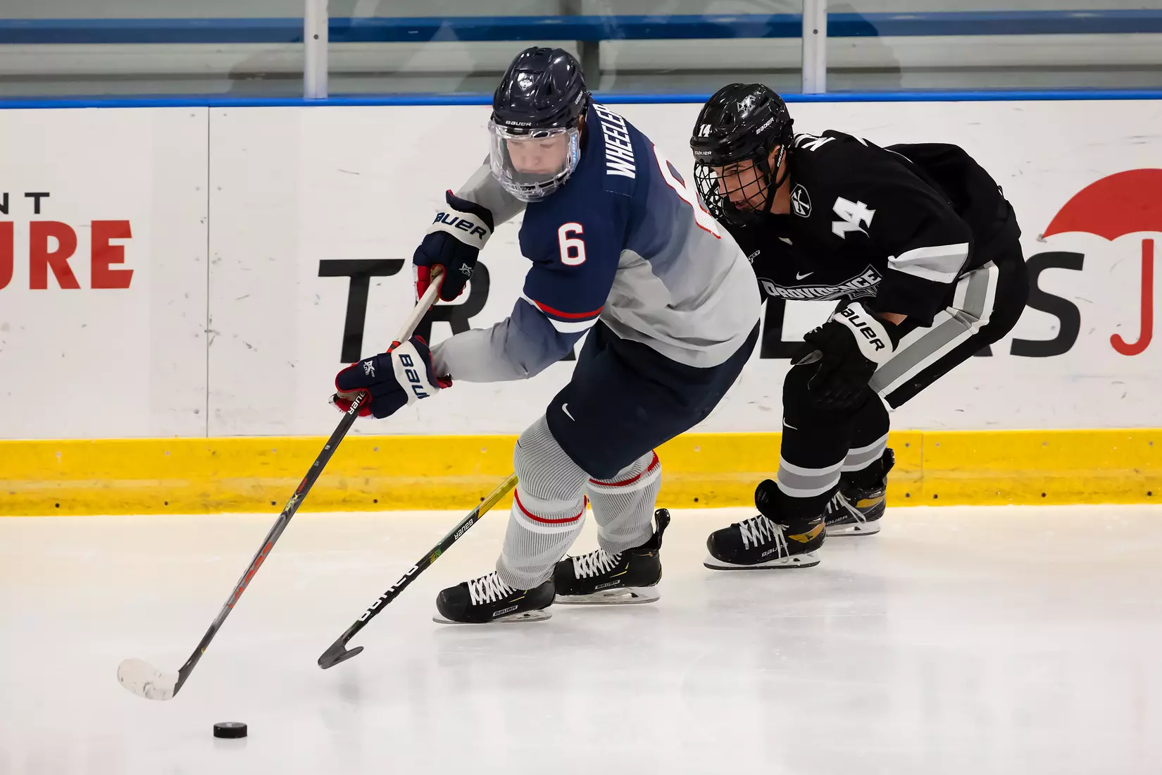 Ryan Wheeler controls the puck against Providence on December 28, 2020.