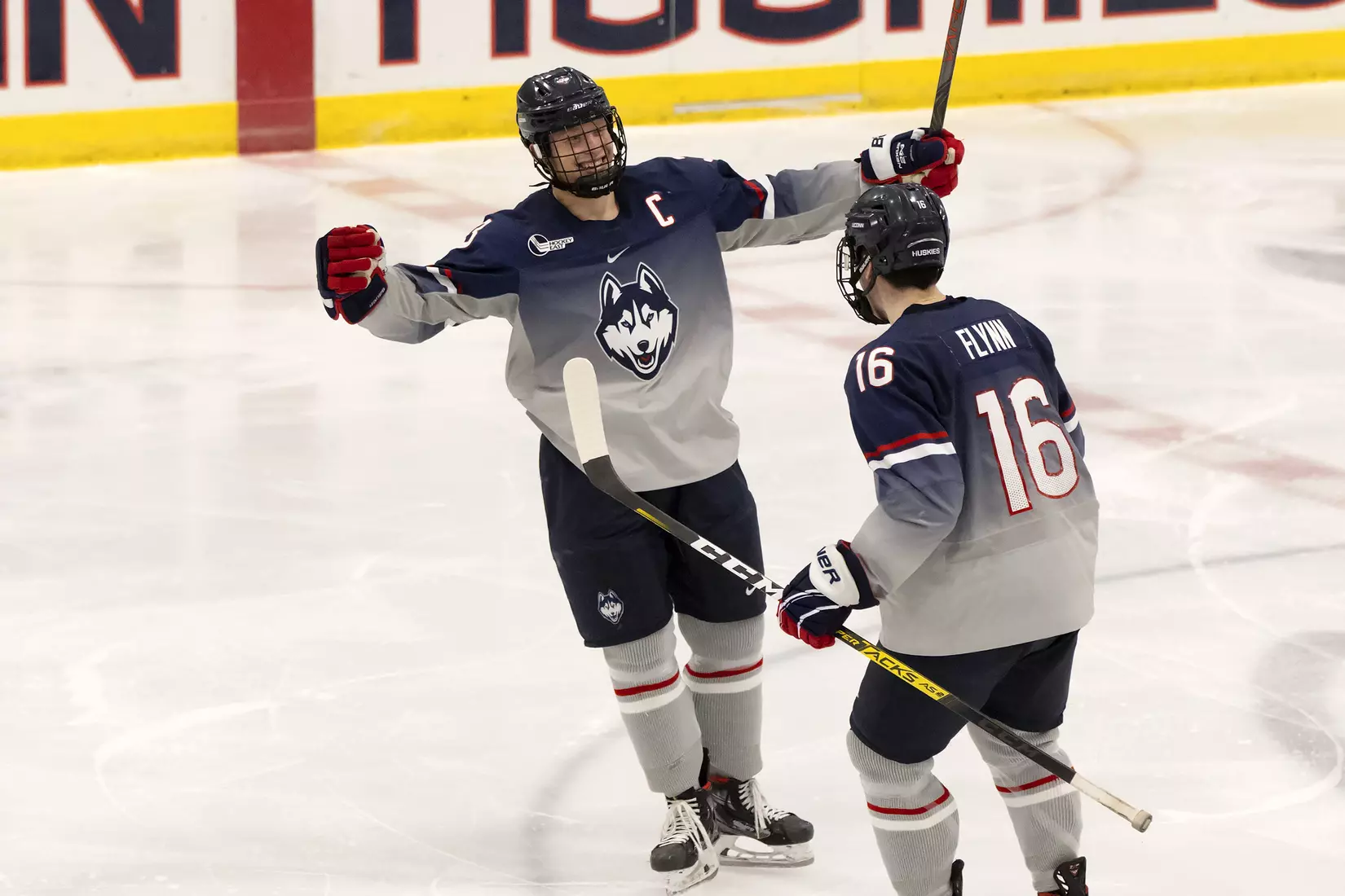 Adam Karashik celebrates with Jake Flynn after scoring against Providence on December 28, 2020.