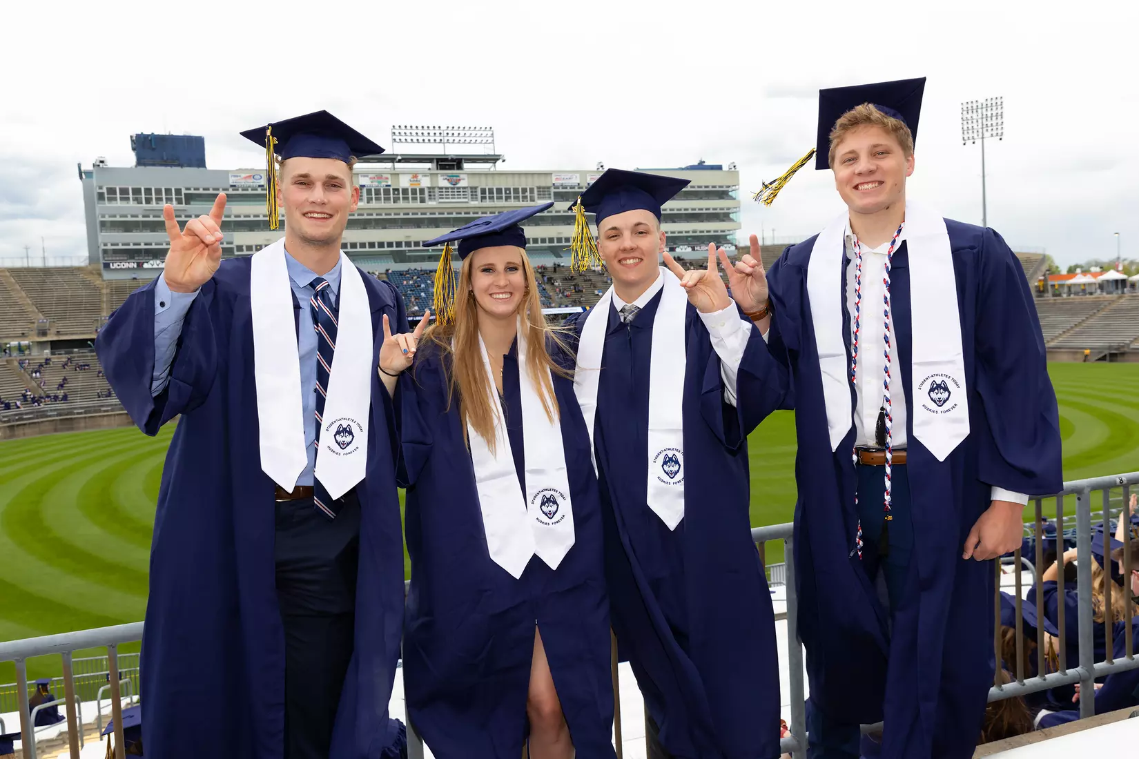 Kyle Dunlap,Katelyn Walsh, Zack Teffeteller and Rowan King (Swimming and Diving) UConn Commencement Ceremony at Rentschler Field May 9, 2021