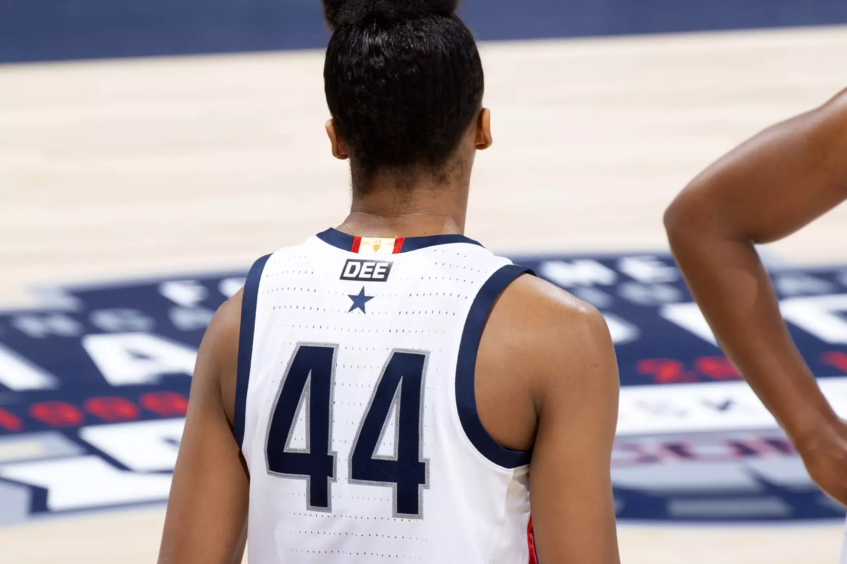 Aubrey Griffin and the Huskies wore DEE patches on the back of their uniforms Tuesday to honor the memory of Dee Rowe.