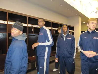 The Huskies look around the Cowboys' locker room.