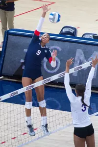 Camille Evans hit a team-bset .750 in the Huskies' setback to Tulsa.