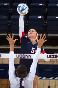 Devon Maugle needs just three digs to become the seventh Husky player with 1,000 career kills and 1,000 career digs.