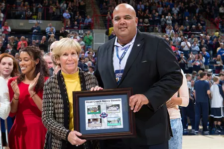 Head coach Nancy Stevens was honored with a framed picture for her 400th win at UConn.