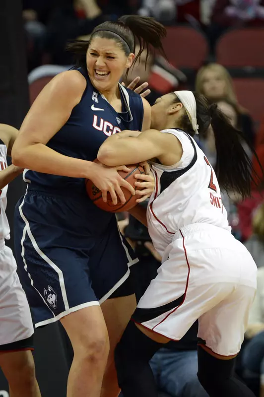 Connecticut Huskies center Stefanie Dolson battles Louisville Cardinals guard Bria Smith for the ball. (Jamie Rhodes-USA TODAY Sports)