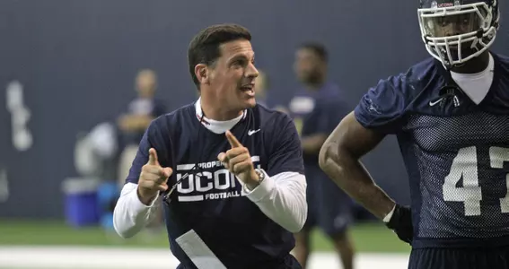 UConn head coach Bob Diaco leads a drill.