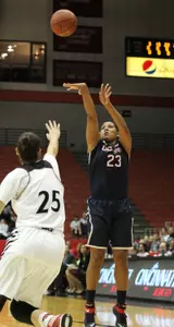 Kalleena Mosqueda-Lewis knocks down a three point basket during the first half.