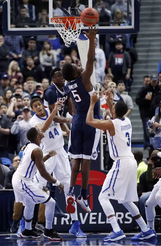 Daniel Hamilton shoots against Tulsa Golden Hurricane guard Shaquille Harrison.