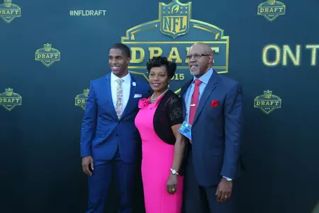 Byron Jones and his parents arrive at the NFL Draft on Thursday.
