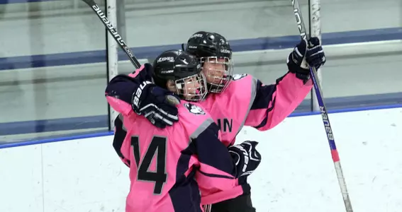Sophomores Theresa Knutson and Justine Fredette celebrate after tying up the game 1-1 against NU.