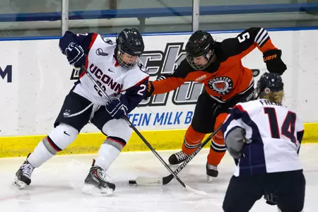 Junior Kelly Harris battles for a puck against Princeton Monday.