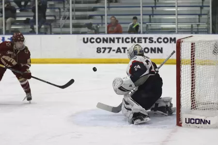 Morgan Fisher makes save against BC on Saturday (PC: Alex Serbetzian).