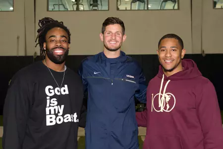 UConn football alumni Geremy Davis, Dan Orlovsky, and Andrew Adams watched Pro Scouting Day on Wednesday.