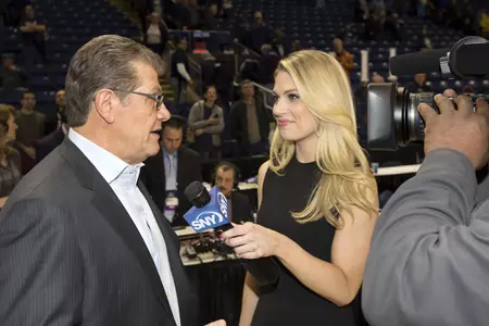 Geno Auriemma being interviewed by Justine Ward of SNY UConn vs Oregon NCAA Regional Final (photo by Stephen Slade